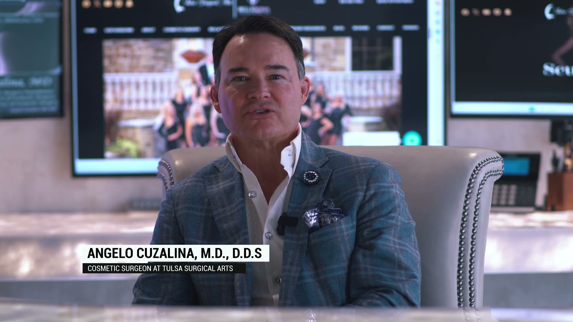 Dr. Angelo Cuzalina, seated at Tulsa Surgical Arts, introducing the practice on camera