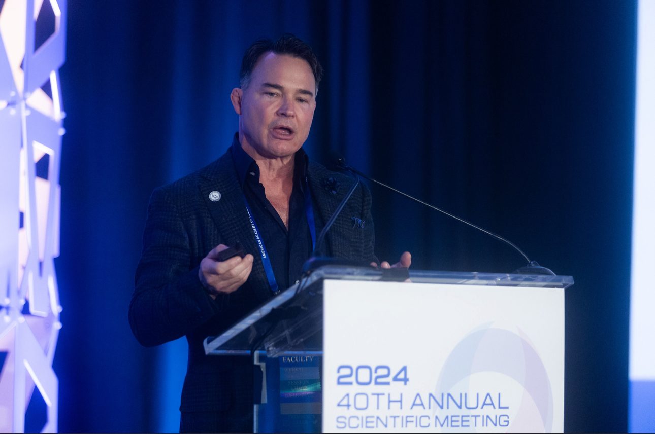 Dr. Angelo Cuzalina lecturing at the podium of the 2024 AACS 40th Annual Scientific Meeting