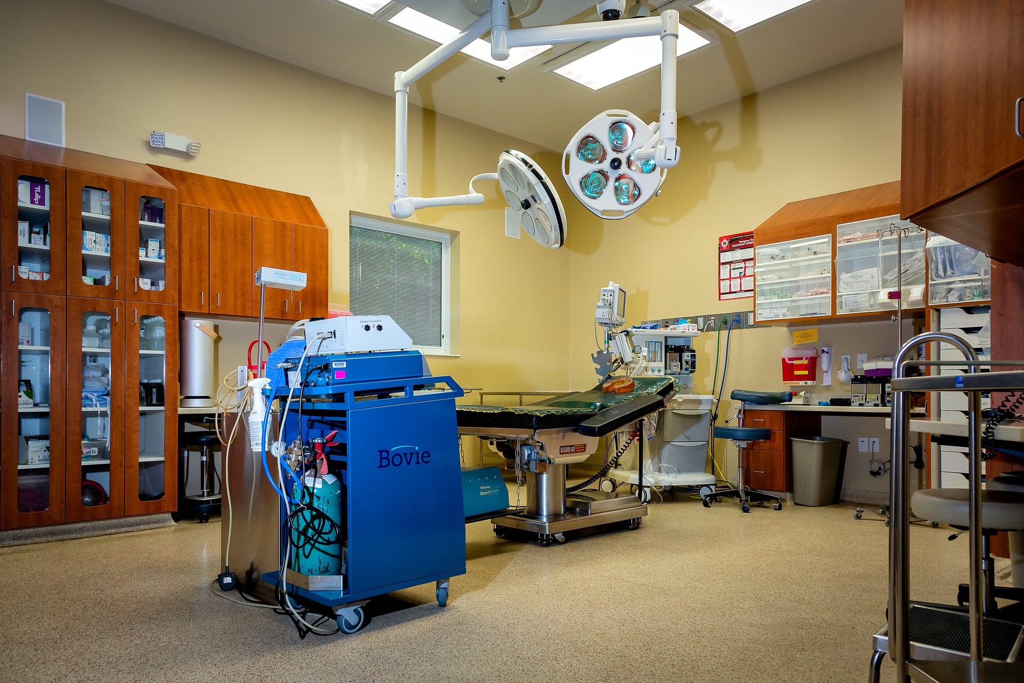 An operating room at the Tulsa Surgical Arts villa, with surgical lights and equipment set for a case